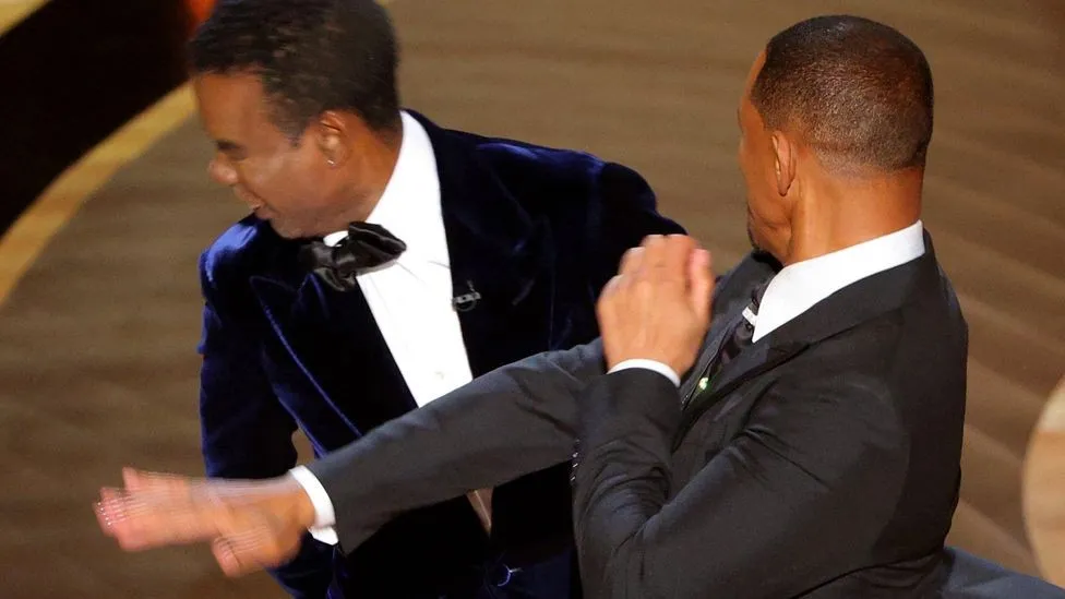 Will Smith striking Chris Rock on stage at the Oscars