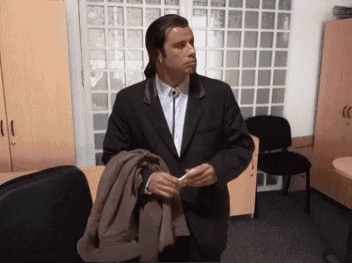 John Travolta in Pulp Fiction looking around an empty room, bewildered