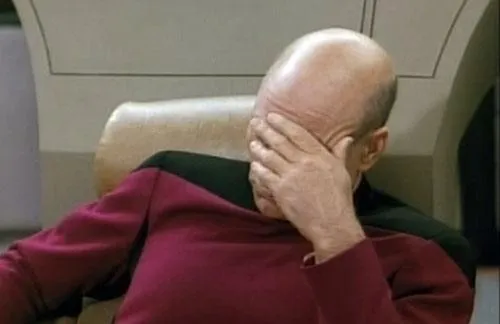 Captain Picard with his face in his hand