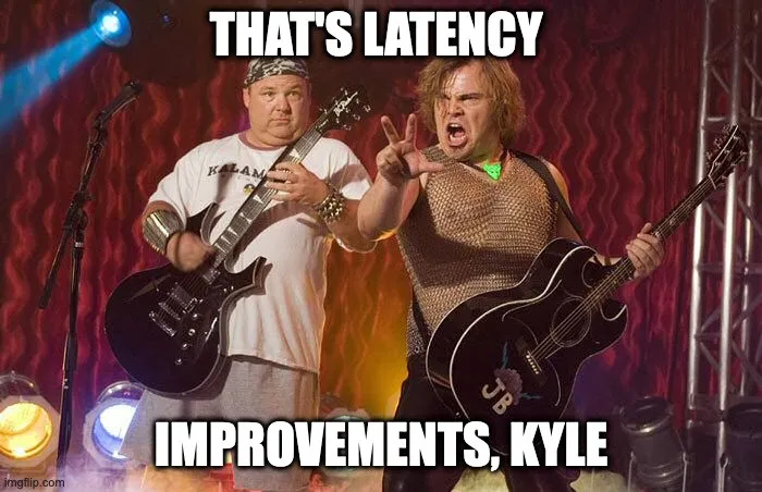 Two rock guitarists mid-performance, captioned “that’s latency improvements, Kyle”